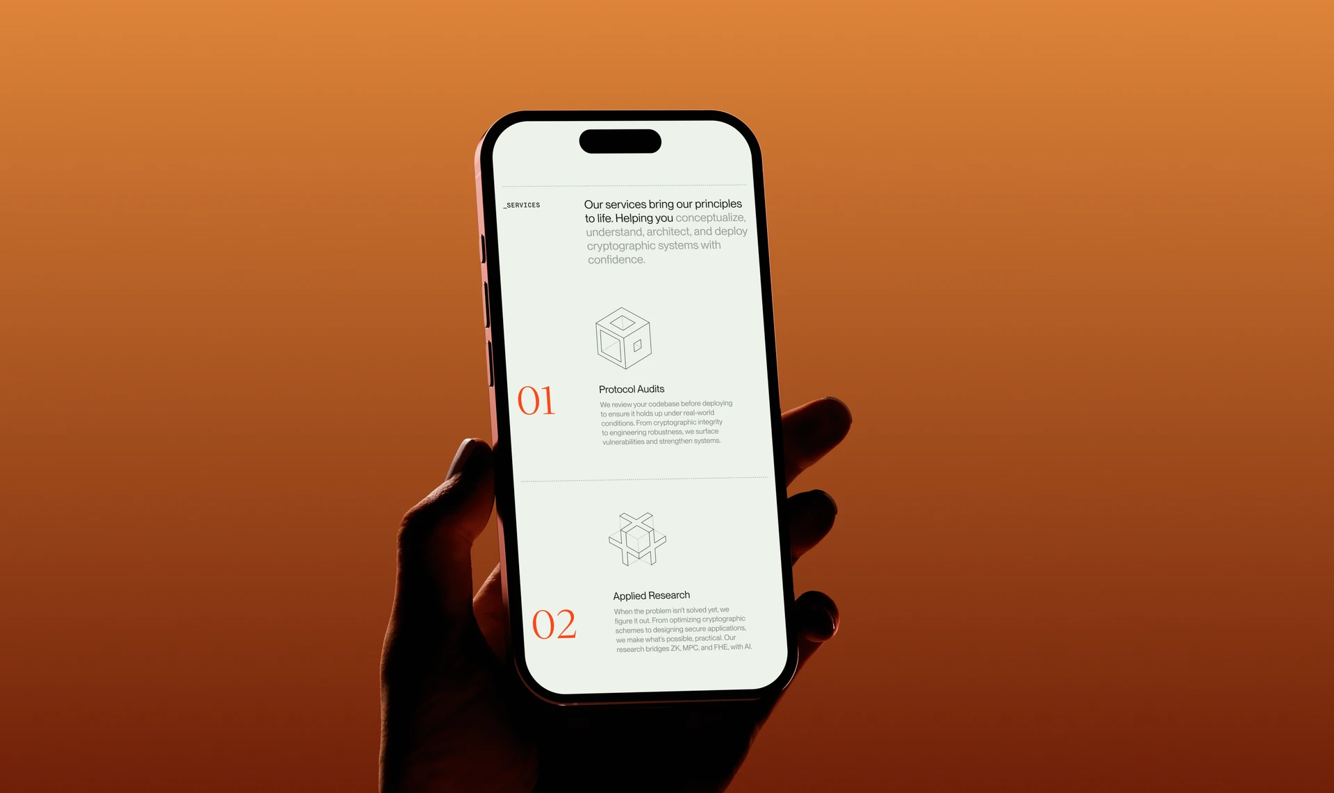 Hand holding a phone with the Inversed services page